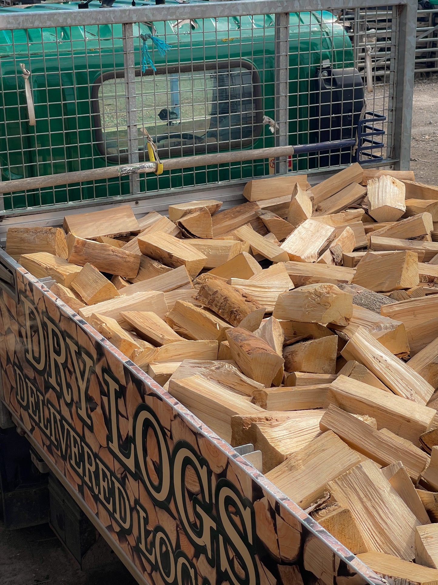 A side view of our jumbo load of seasoned firewood loaded into our local delivery van.