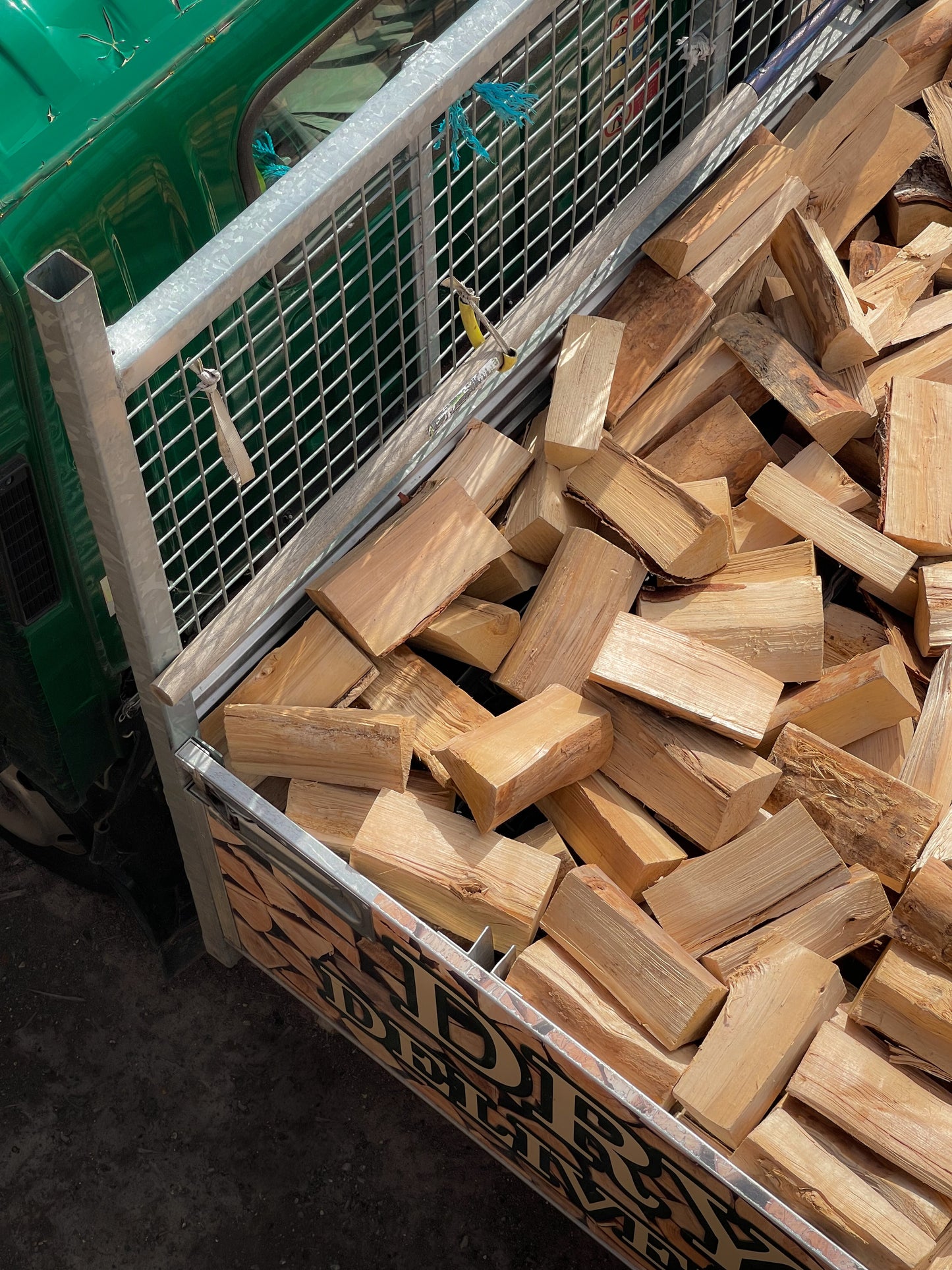 A top view of our jumbo load of seasoned firewood loaded into our local delivery van.