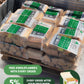 Pallet of packaged kiln dried firewood bags with badges for free KindleFlamers with every order and 5% off subscribed orders after the first.