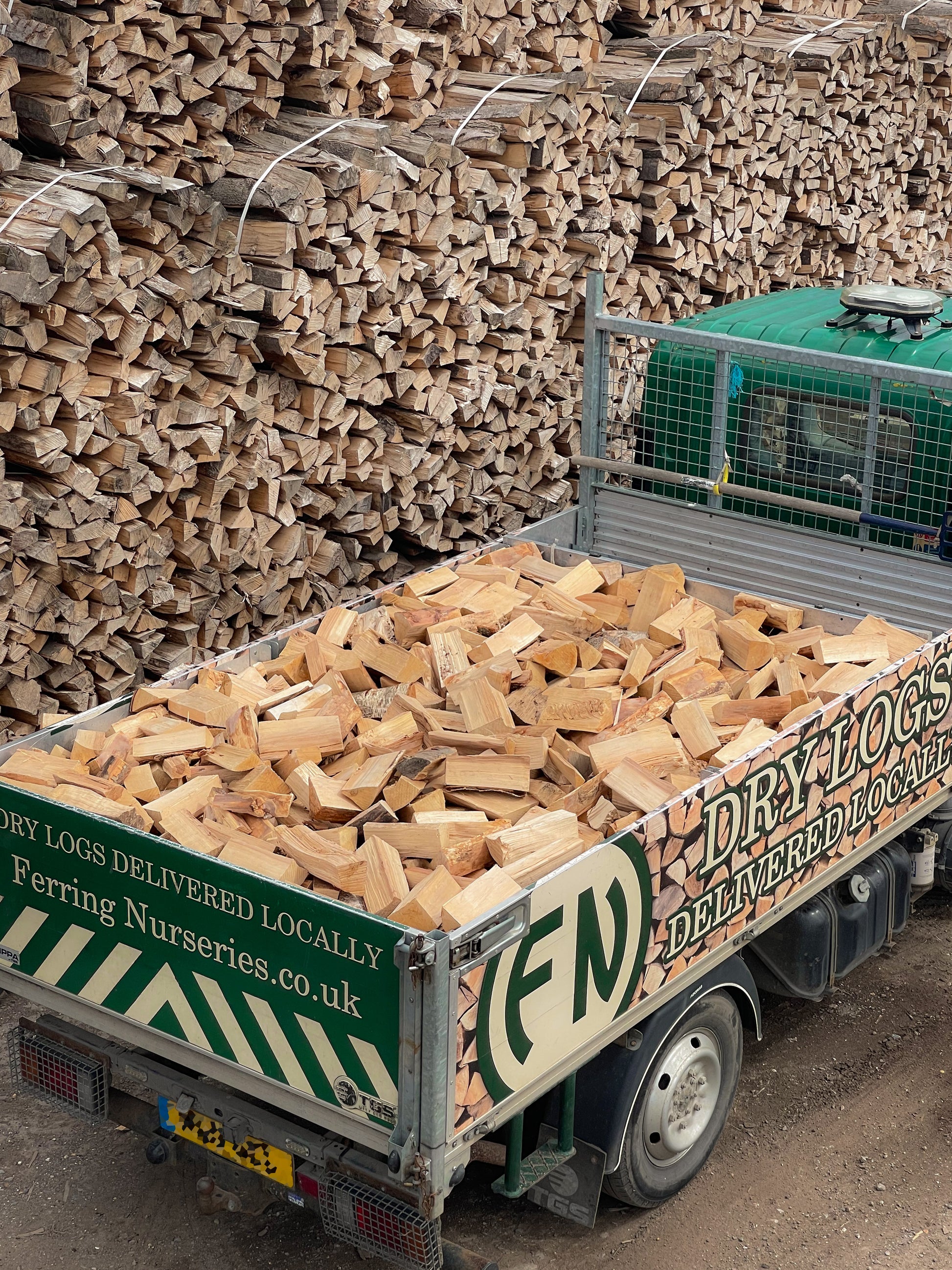 Full load of hardwood seasoned firewood in the back of our local delivery van.