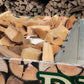 A closeup side view of our half load of seasoned firewood loaded into our local delivery van.