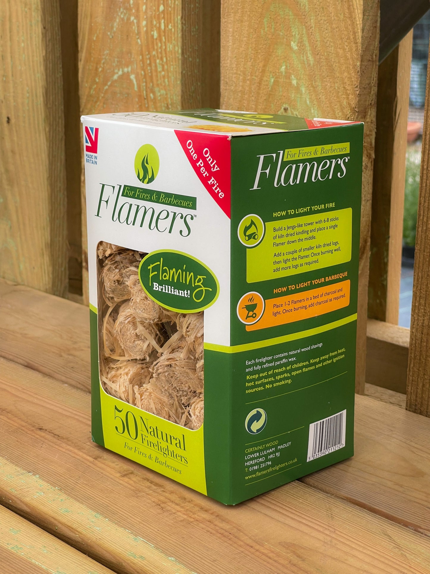 Single box of Flamer Firelighters 50 Pack sat on a wooden display bench